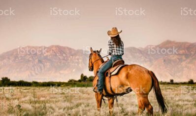 Cowgirl Horseback Riding in Utah at Sunset Cowgirl Horseback Riding in Utah at Sunset